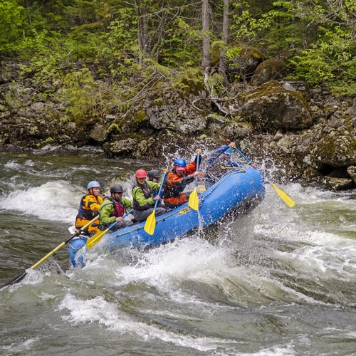 Raft going through rapids